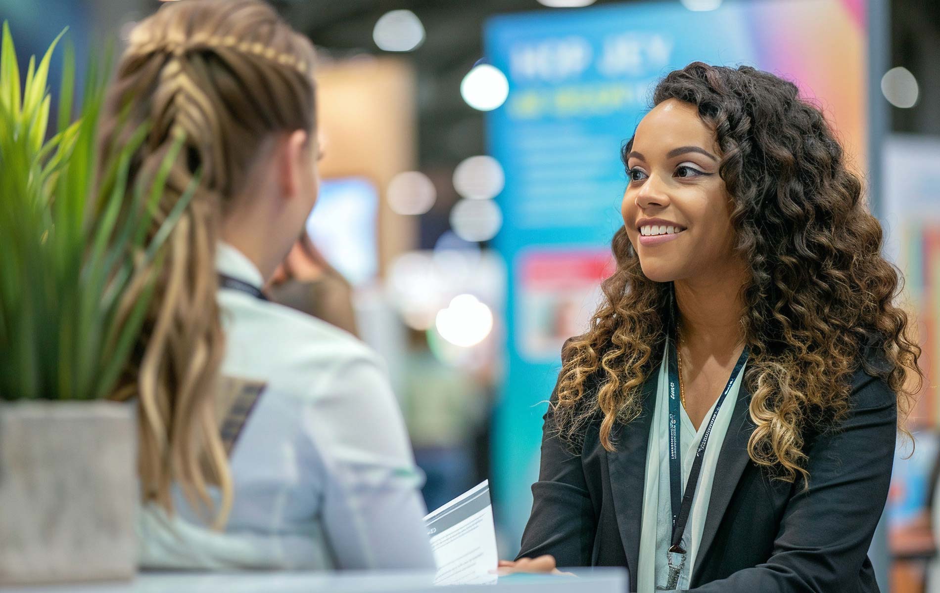An event attendee visiting a vendor's booth